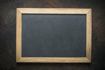 Wall Mural - Vintage chalkboard in wooden frame on darke background. 