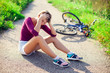 © Aleksej - Woman with head injury after biking on bicycle. Sport, healthcare and people concept