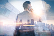 © TimeStopper - The double exposure image of the businessman using a smartphone during sunrise overlay with cityscape image. The concept of modern life, business, city life and internet of things.