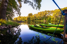 Green Canoe Berthed In Wilanow River