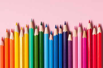 Color pencils isolated on pink background.
