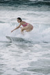 © karrastock - Young woman surfing the wave on his surfboard