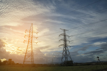 high voltage post,High voltage tower sky sunset background