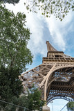 Fototapeta Paryż - The Eiffel tower is one of the most recognizable landmarks in the world under cinematic color graded sky