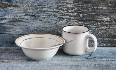 White plates with cup on a blue wood background