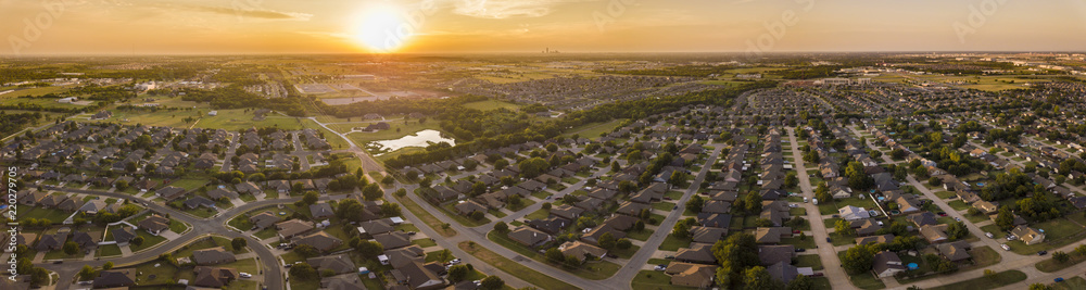 Aerial panorama of planned development and neighborhoods in Oklahoma City at sunset. - obrazy, fototapety, plakaty 