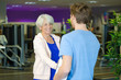 © auremar - senior woman handshaking personal trainer