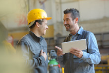 Workers Talking And Laughing At A Factory