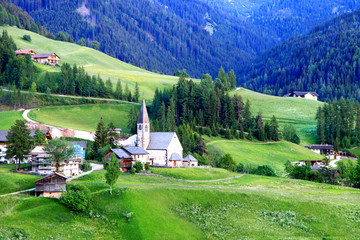 The Odle mountain peaks are the symbols of the Val di Funes, Italy. Church of Santa Maddalena with the Odle mountains in the background, is one of the most popular photo spot of the Dolomites.