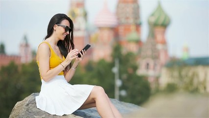 Wall Mural - Happy young urban woman in european city.