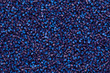 Close up Flat lay of a blue plastic polypropylene granules on a table, copy space