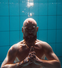 Portrait Of Muscles Beard Yoga Man Underwater In The Swimming Pool