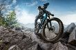 Mountain biker on stone trail. Male cyclist rides the rock