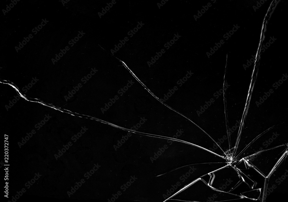 Shards of a broken glass on a black background, shattered pieces. Useful texture in overlay mode. Horizontal shot.
 - obrazy, fototapety, plakaty 