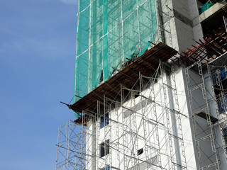 Catch platform or other construction projection from the face of a building. It is protect individuals and property from falling debris during construction. 