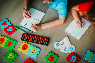 Wall Mural - little girls learning numbers, arithmetic, abacus calculation