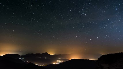 Wall Mural - stars in starry night over country traffic time lapse day to night