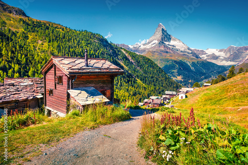 Sunny summer morning in Zermatt village with Matterhorn (Monte Cervino, Mont Cervin) peak on backgroud Fototapete