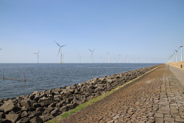 Modern wind turbines in the Noordoostpolder in the Netherlands for sustainable electricity