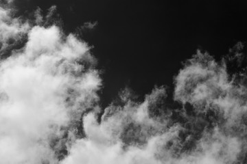 Wall Mural - clouds over black.