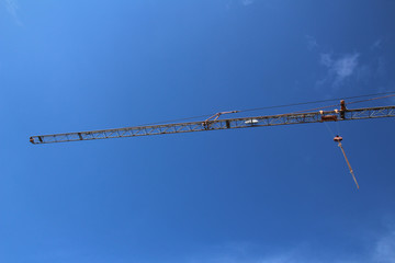 crane with blue sky at a building site