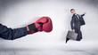 © ra2 studio - Huge Boxing Gloves punches innocent businessman concept