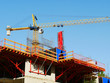 © fotolian121212 - Scaffolding. Construction site with crane and building.