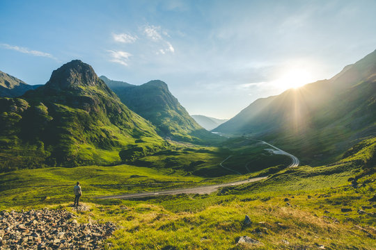 a man looking standing face to the sun at glencoe