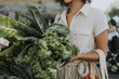 © Rawpixel.com - Beautiful woman buying kale at a farmers market