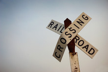 Old Worn And Rusted Railroad Crossing Sign