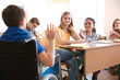 © Africa Studio - Boy in wheelchair with classmates at school