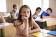 © Africa Studio - Sad girl sitting in classroom. Bullying at school