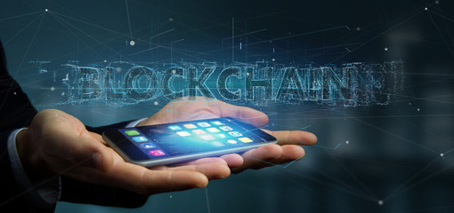 Poster - Businessman holding a Blockchain title isolated on a background