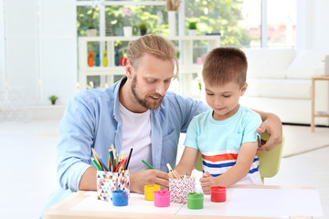 Poster - Father drawing with cute son at home