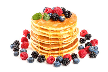 Wall Mural - Pancakes stack with different berries and honey isolated on white background