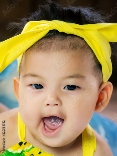 Portrait Of Cute Short Hair Asia Baby Girl In Color Full