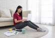 © weedezign - asian woman freelance working on laptop with paperwork at home,work at home concept.online learning concept.