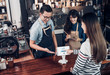 © weedezign - customer self service order drink menu with tablet screen and pay bill online at cafe counter bar,seller coffee shop accept payment by mobile.digital lifestyle concept.