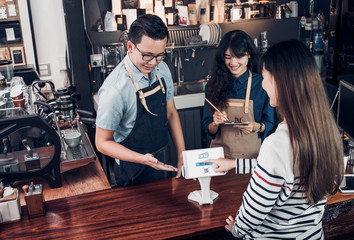 Poster - customer self service order drink menu with tablet screen and pay bill online at cafe counter bar,seller coffee shop accept payment by mobile.digital lifestyle concept.