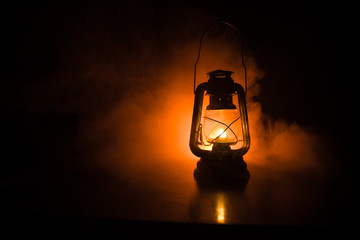 oil lamp lighting up the darkness or burning kerosene lamp background, concept lighting. selective f