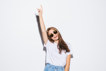 Wall Mural - Sylish beautiful young woman with sunglasses in summer clothes isolated on white background