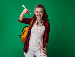 Wall Mural - happy young student woman writing in air with big pen