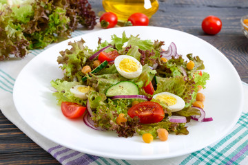 Wall Mural - Dietary, vegetarian salad with quail eggs, fresh herbs, chickpeas, red onions and cherry tomatoes.