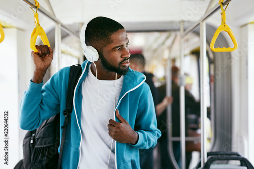 Man In Headphones Listening Music Riding In Transport Tableau sur Toile