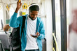 © puhhha - Man Using Phone, Listening Music Traveling In Train