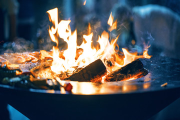 Preparation of shrimp on fire, grill at night