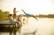 © BGStock72 - Group of young people having fun on pier at the lake