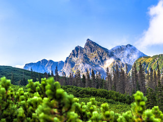 Polish Tatra mountains summer landscape with blue sky and white clouds. Panoramic HDR montage