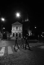 Pedestrians Crossing Street At Night, Rome, Italy