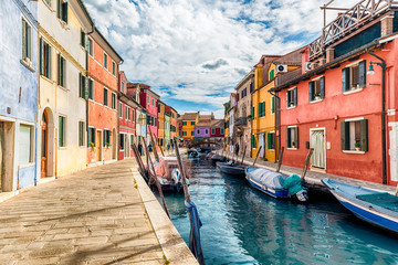  Colorful houses along the canal, island of Burano, Venice, Italy